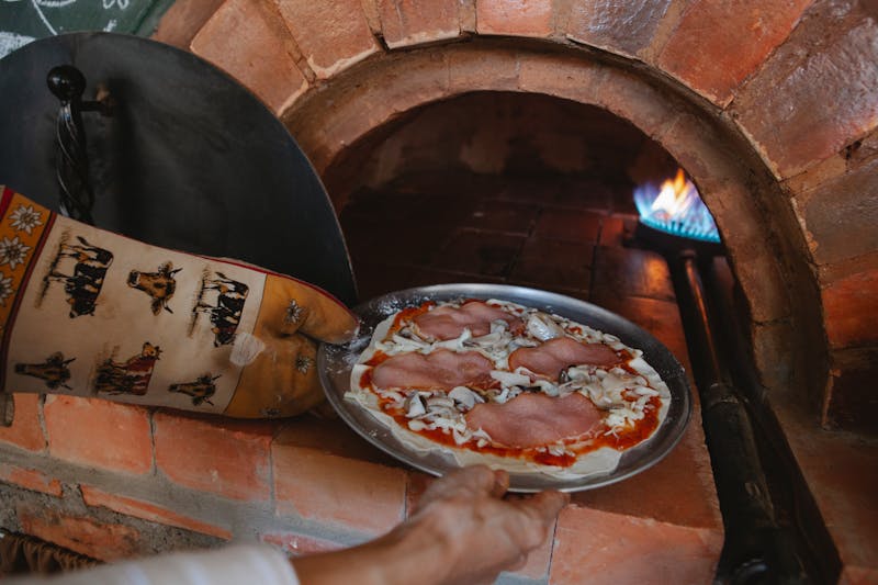 Wood-fired pizza oven at Pizzana